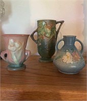 Three small Roseville pottery vases, one Holly