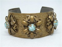 UNUSUAL CUFF BRACELET WITH PRONG SET STONES