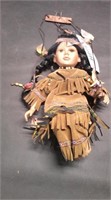 SWINGING NATIVE DOLL