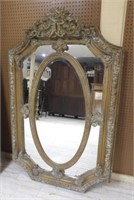 Ornate Gilt Framed Oval Centered Mirror.