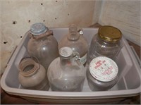 Plastic bin of 6 lg glass jugs & bottles
