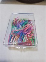 Container of multi color paper clips