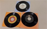 Three 7" Records Incl. Jimmy Buffett