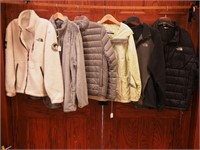 Four North Face clothing items including