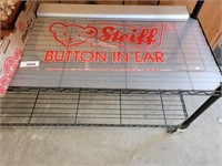 STEIF BUTTON IN EAR ACRYLIC SIGN