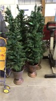 4 matching prelit Christmas trees