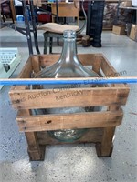 Wood crate with glass jug stamped 25