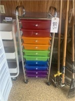 Rolling rack of colorful file boxes