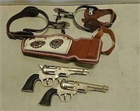 Toy Hubley coyote cap guns, holster, and spurs