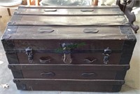 Antique steamer trunk with metal and leather