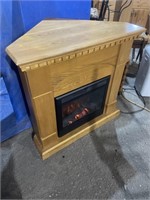 a working electric corner fireplace, measures 40