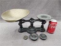 Balance scale with removable pan and 3 weights.