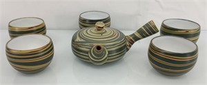 Porcelain tea pot and cups