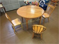 Round child's table and four chairs