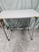 Origami folding table 32" H x 35.5" L x 24" D.