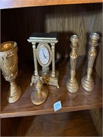 Brass décor on shelf
