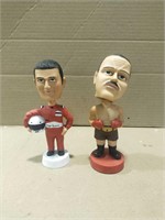 Race car driver and boxer bobbleheads