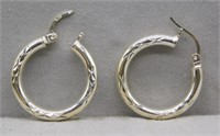 Sterling Silver hoop earrings.