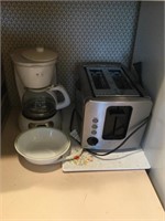 Coffee pot, toaster, cutting board, bowl