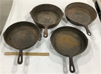 4 cast iron skillets -no visible brands