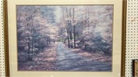 Large framed print of a lane in the woods - looks