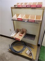 Peg Board Display Rack with Parts, Boxes,  & Hoses