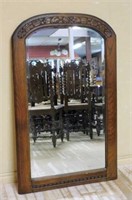 Carved Oak Framed Beveled Mirror.