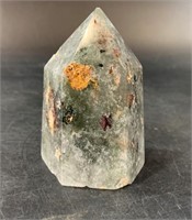 Faceted crystal rock about 3" long with many inclu