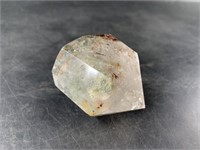 Faceted crystal rock about 2" long with many inclu