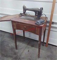 >Singer Sewing Machine in cabinet