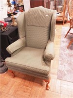High wingback chair with cabriole legs and