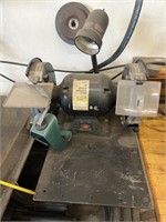 8 inch bench grinder with lamp on metal plate