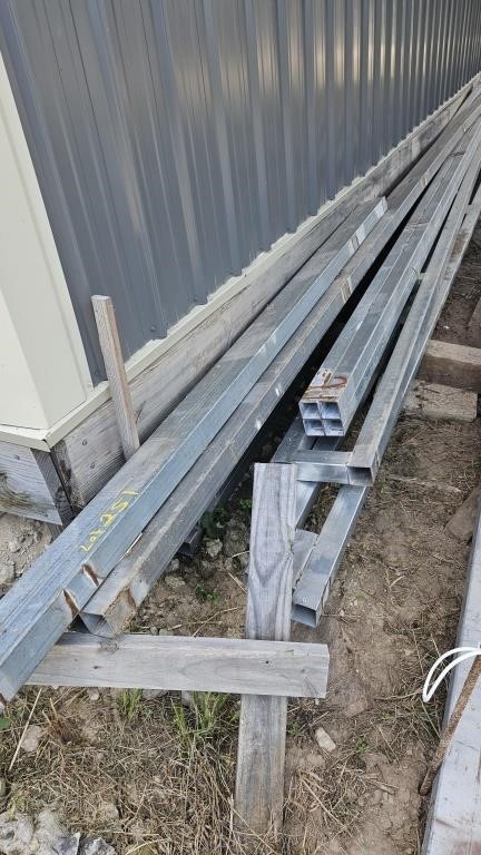 Lot of square tubing next to building