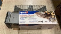Two small live animal cage traps.   655.