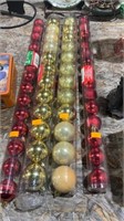4 tubes of christmas ornaments
