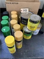 Partial cans of John Deere paint
