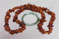 Amber Necklace and Jade Bangle.