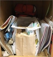 Contents of cabinet. Notebooks and lunch box.