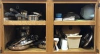 Contents of cabinet. Revere ware pots and pans.