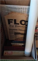 box of books and vintage newspapers