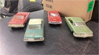 4 plastic model cars