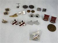 Assorted tie clasps and cufflinks