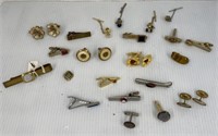 Assorted tie clasps and cuff links