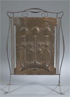 Art Nouveau repousse copper fire screen.