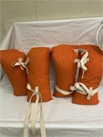 Two orange life jackets/floatation