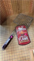 Campfire cooker and metal sign