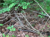 Antique farming Implement(s) on Left  in Woods -