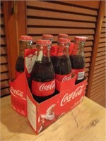 coca cola holder and bottles