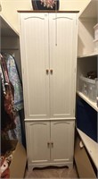 White four-door storage cabinet  24" x 72" x 12"