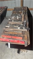 LARGE TABLE OF ASSORTED NEW MOWER BLADES